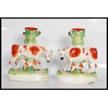 A pair of 19th Century Victorian Staffordshire flatback spill vases. Each having oval naturalistic