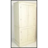 A 20th Century upcycled painted pine scullery / larder upright two piece cupboard. Twin panel