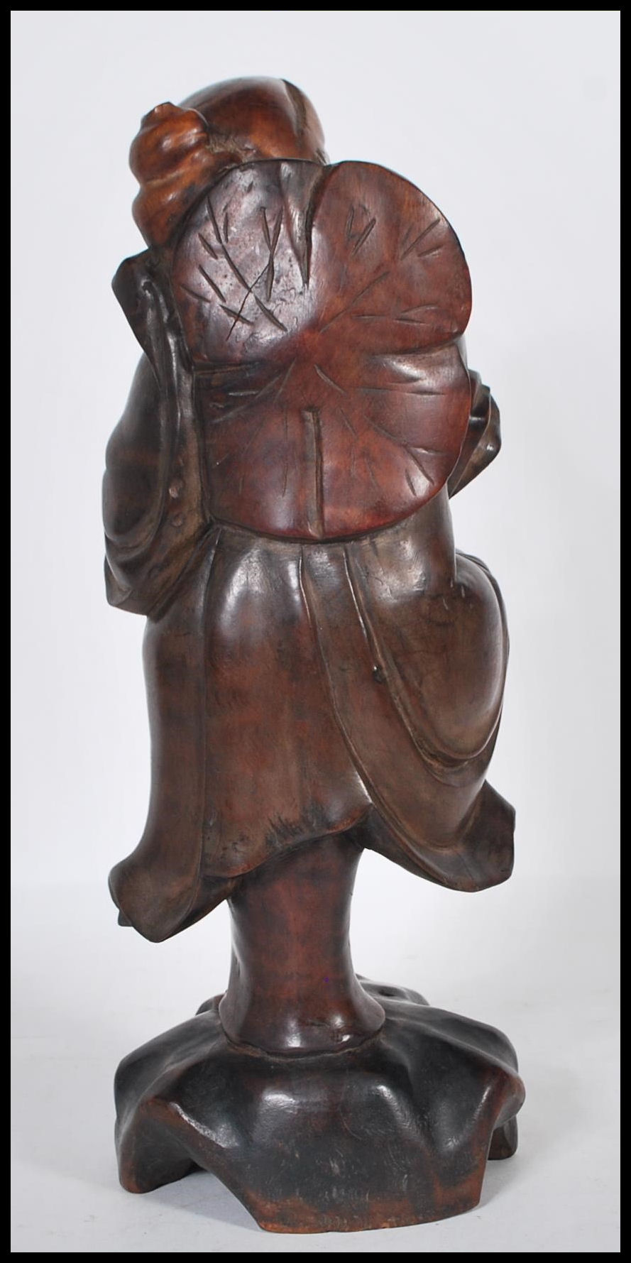 An early 20th Century Chinese carved hardwood figure of an Immortal holding a gnarled staff with one - Image 3 of 6