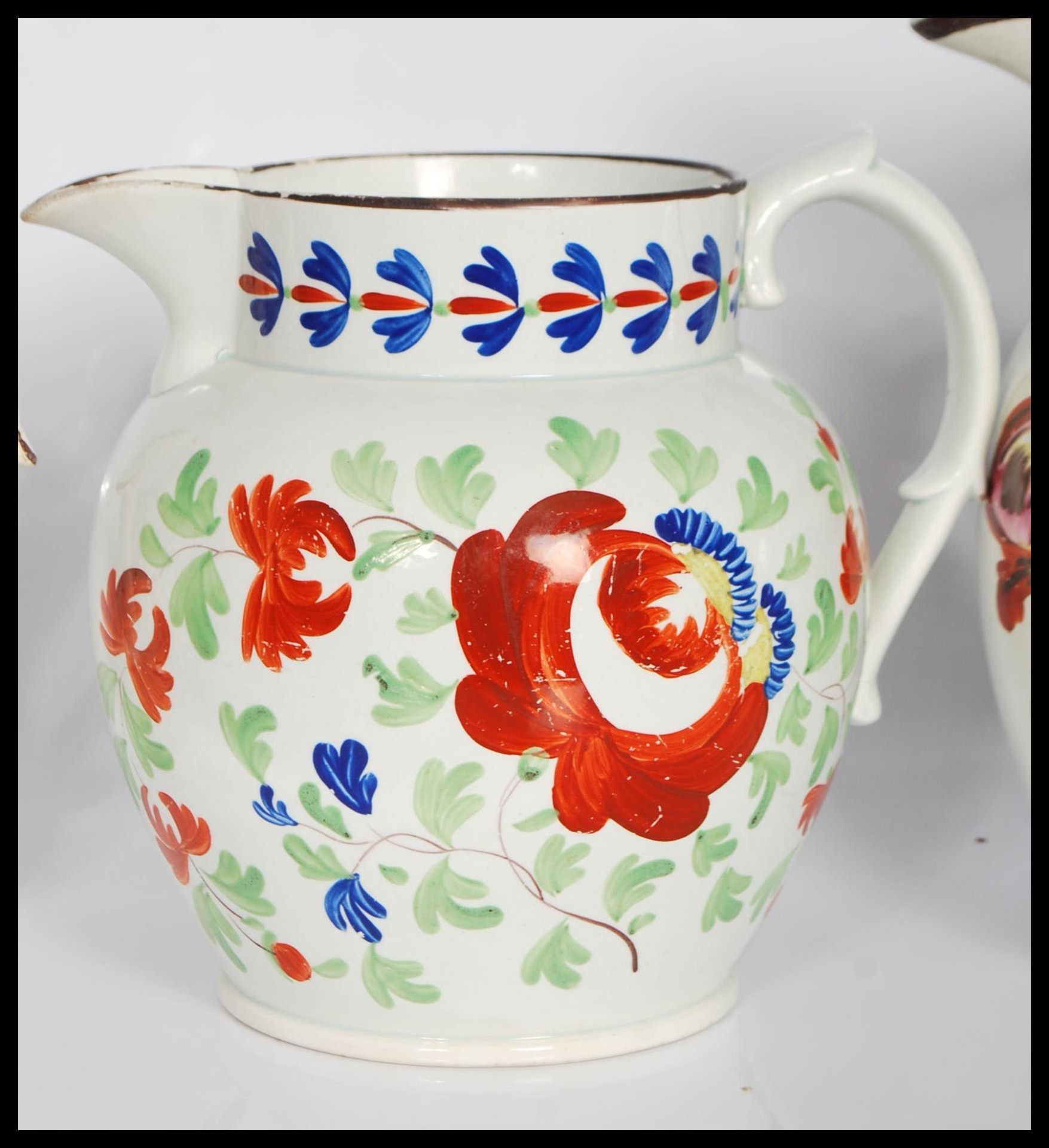 A group of three 19th Century Staffordshire jugs all having hand painted floral sprays to include - Bild 4 aus 7