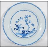 An 18th Century Qianlong Chinese porcelain blue and white hand painted plate, having a pine tree