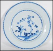 An 18th Century Qianlong Chinese porcelain blue and white hand painted plate, having a pine tree