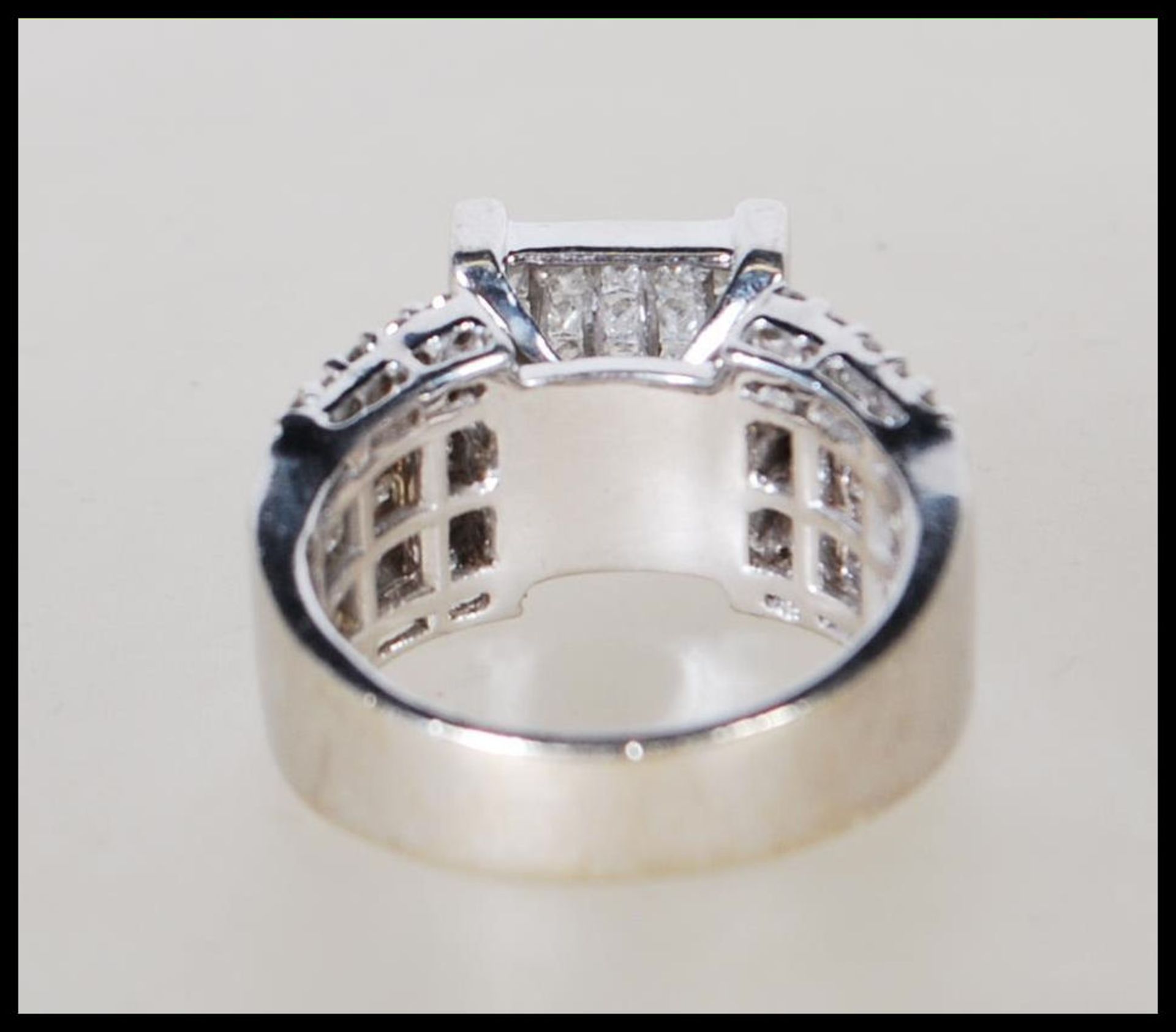 A stamped 14ct white gold and diamond ring. The head having a pave set of diamonds on a suspended - Bild 3 aus 5
