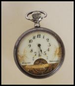 An early 20th Century Hebdomas 8 Jours open faced pocket watch with roman numeral chapter ring,