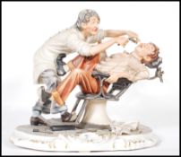 A Capodimonte ceramic figurine depicting a dentist extracting a tooth from a patient, raised on a