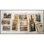 A collection of vintage postcards and photographs dating from the early 20th Century to include