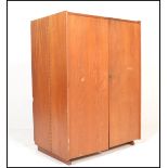 A retro mid 20th Century 1970's teak wood office Industrial cube desk / filing cabinet having twin