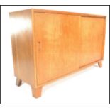 A mid 20th Century 1940's utility light oak sideboard of simple rectangular form having double