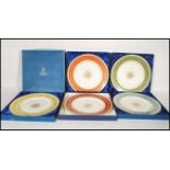 A collection of five commemorative cased Royal Worcester plates given to members of staff for