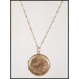 A stamped 9ct gold locket of round form engraved w