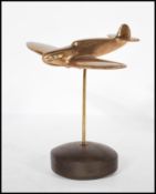 A mid 20th Century vintage trench art style brass desk ornament of a WWII second world war