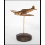 A mid 20th Century vintage trench art style brass desk ornament of a WWII second world war