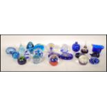 A collection of glass paper weights to include Caithness, Gozo glass, Selkirk, Pembrokeshire, London