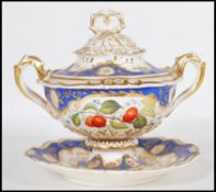 A 19th Century English Regency lidded ceramic twin handled tureen having detailed floral gilt work