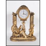 A contemporary Juliana figural pendulum quartz clock, the movement held aloft on classical