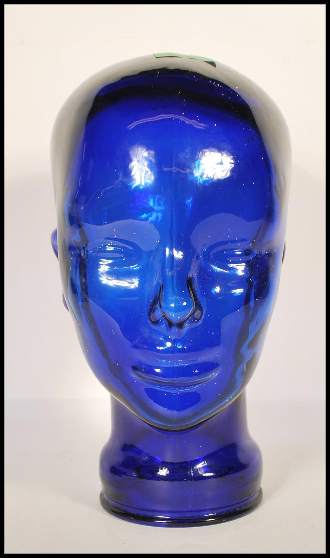 A 20th century art deco style moulded pressed glass phrenology type head - shop display stand /