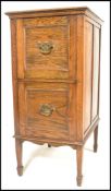 A vintage 20th Century oak two drawer filing cabinet, flared top over two deep panel drawers
