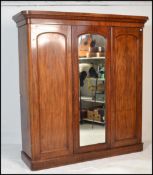 A Victorian mahogany triple wardrobe linen press c