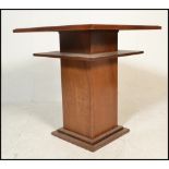 An early 20th Century 1920's oak Art Deco centre / occasional table of square form having a two tier