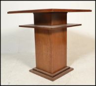 An early 20th Century 1920's oak Art Deco centre / occasional table of square form having a two tier