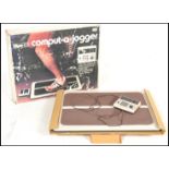 A retro 20th Century boxed rare Computer-A-Jogger computer plug in fitness running machine. Original