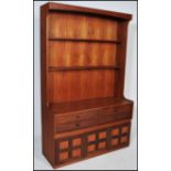 A retro 20th Century Teak wood highboard bookcase cabinet dresser by Nathan with a series of open