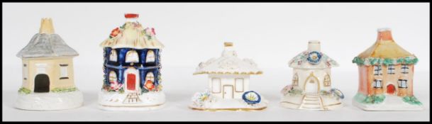 A group of five 19th Century Victorian Staffordshire pastille burners in the form of cottages having