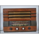 A 1940's vintage Regentone Mullard valve table Radiogram set within a veneered case of rectangular