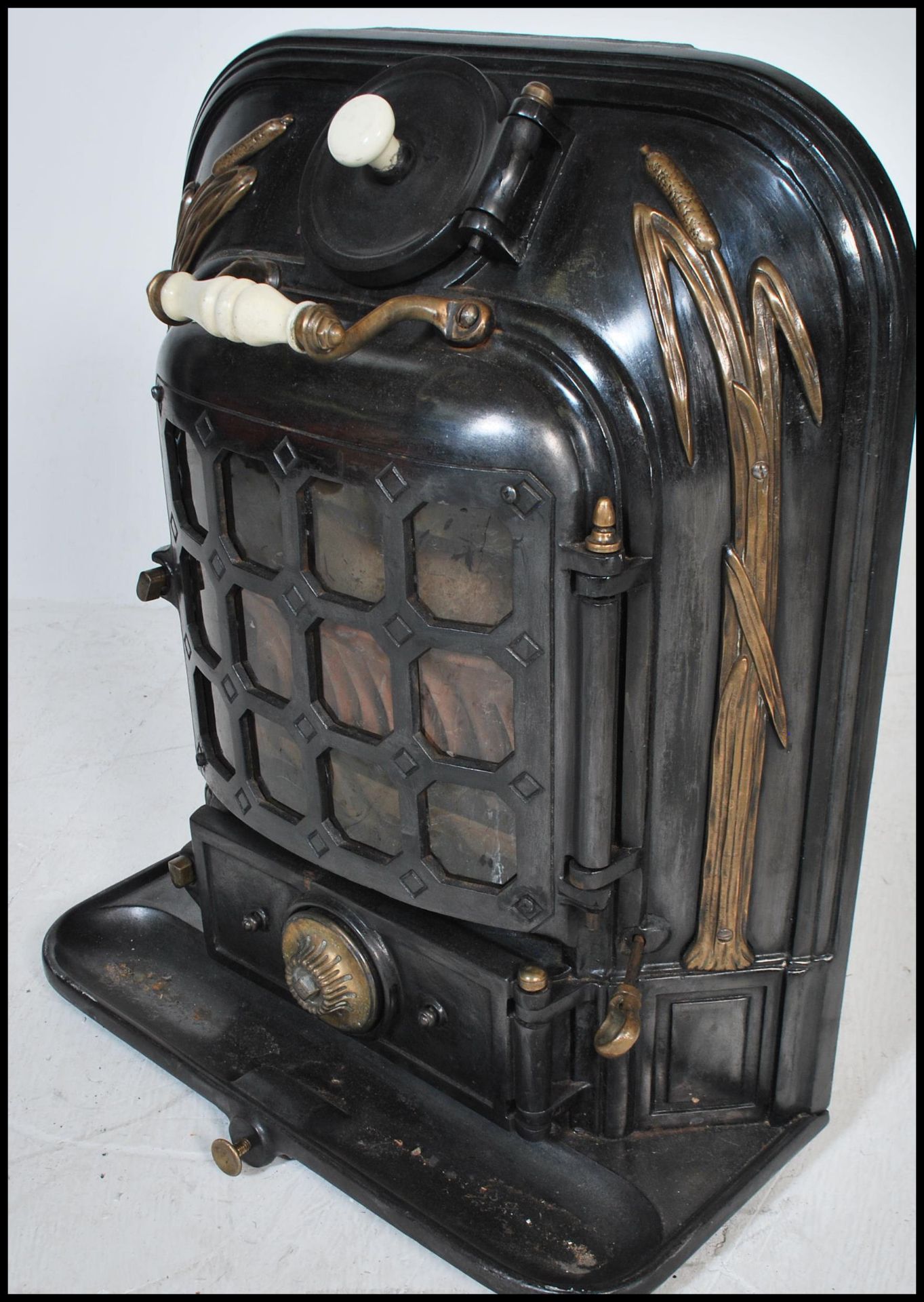 An early 20th Century antique La Salamandre stove having gilt reed decoration with a paneled glass - Image 3 of 5