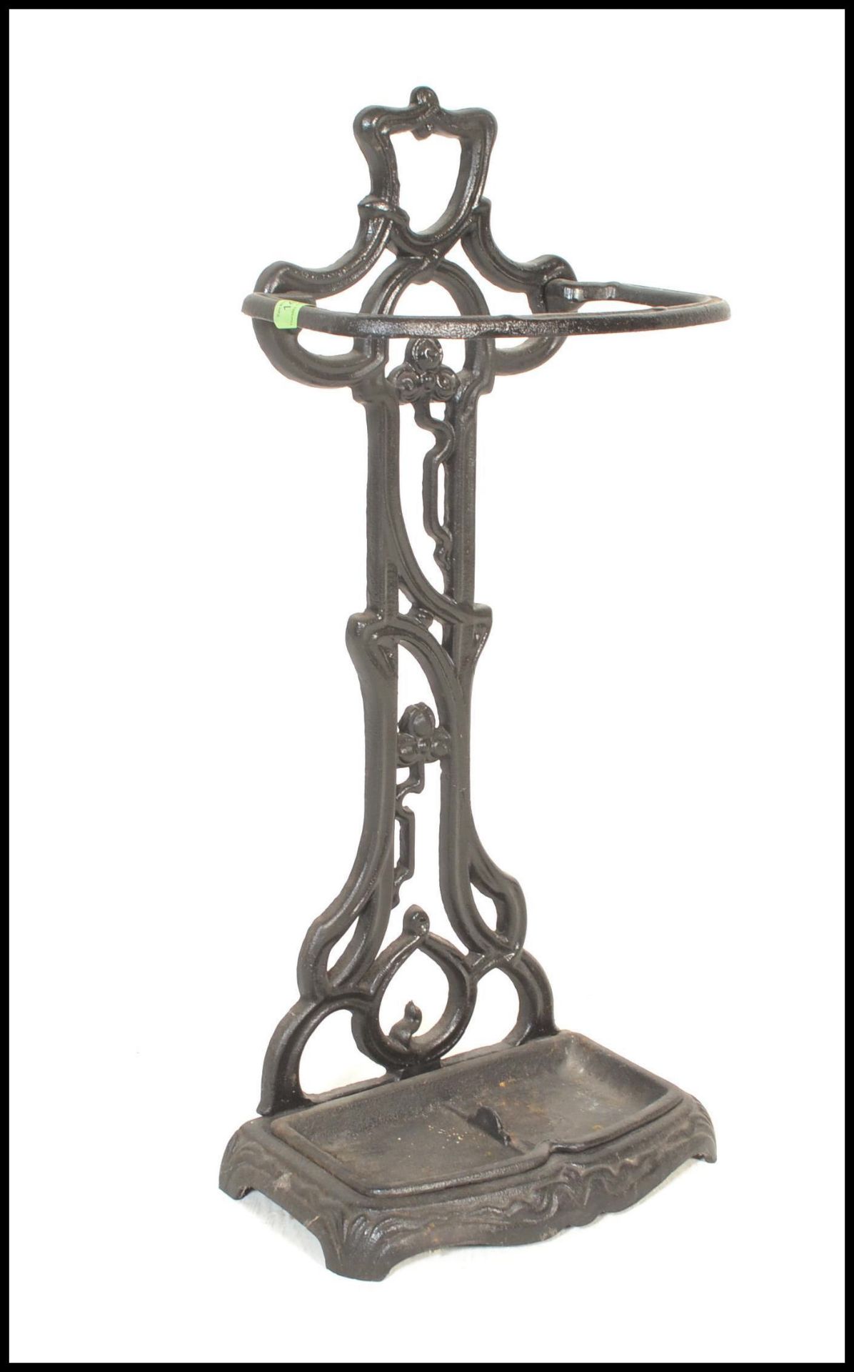 A 20th Century cast iron two sectional stick stand in the manner of Coalbrookdale having an ebonised