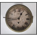 A mid 20th Century Smiths Astral brass cased ships clock. The circular dial with Roman numeral