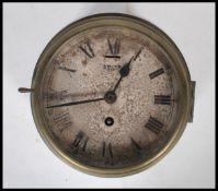 A mid 20th Century Smiths Astral brass cased ships clock. The circular dial with Roman numeral