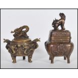Two 20th Century Chinese incense burners one of brass construction decorated in relief with