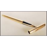 An 18ct gold Waterman's ink writing pen having a reeded gold case with an 18ct gold nib, with a