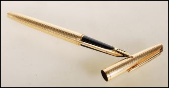 An 18ct gold Waterman's ink writing pen having a reeded gold case with an 18ct gold nib, with a