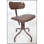A retro vintage 20th Century industrial machinists swivel chair having a quadrapod base and