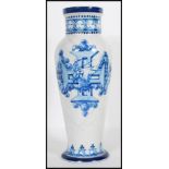 A 19th Century Italian faience vase of tapering form painted with a central cross and naval boat