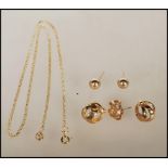 A collection of 9ct gold jewellery to include a pair of knot earrings, a pair of orb stud