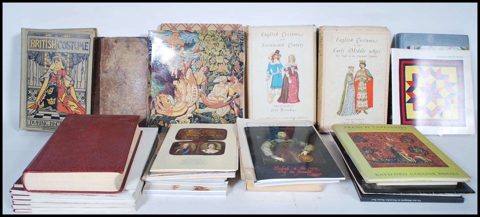 A collection of vintage and antique fashion and costume related books, most being illustrated to
