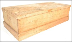 A large 19th Century Victorian pine blanket box chest, hinged flared top over solid sides raised