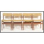 A set of four retro 20th Century Danish inspired teak wood dining chairs in the manner of Kofod