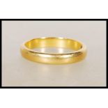 A hallmarked 22ct gold wedding band ring. Hallmarked Birmingham 1960. Weight 3.6g. Size K.5.