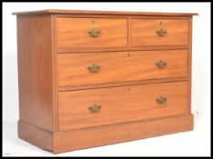 An early 20th Century Edwardian cottage walnut chest of drawers, two short drawers over two long