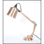 A retro 20th Century copper and plastic angle poise Mac Lamp, model number 8. Raised on a circular