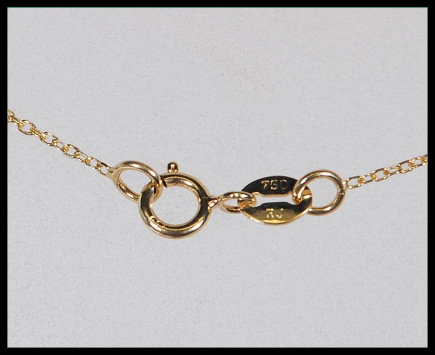 A hallmarked 18ct yellow gold necklace having a pendant in the form of a four leaf clover set with - Image 6 of 6