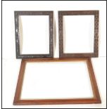 A 19th Century maple wood picture frame having gilt centre together with two carved mahogany