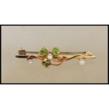 A 15ct yellow gold wirework brooch having central decoration in the form of a clover with each of