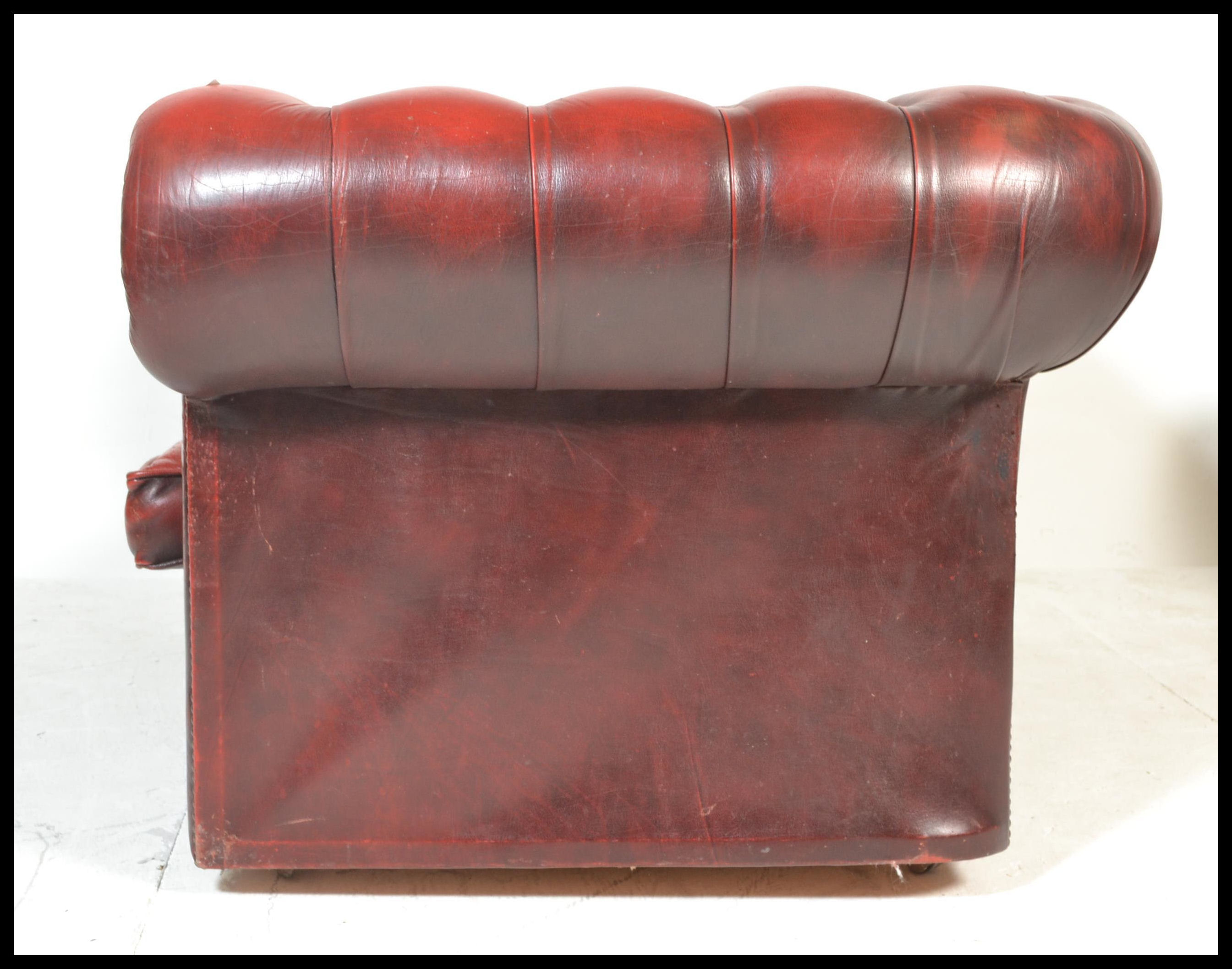 A 20th Century Oxblood leather upholstered chesterfield two seater sofa, having buttoned rounded - Image 4 of 4