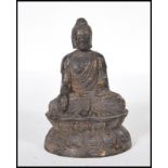 A 19th Century cast bronze figurine of a mandalay style Buddha depicted seated in the lotus position