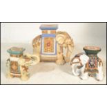 A 20th century Ceramic Plant Stand / stool in the form of an Asian / Indian Elephant together with
